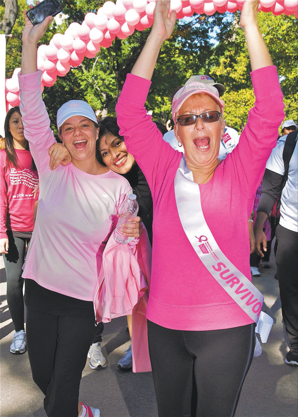 WE ARE THE CHAMPIONS: Cancer survivors and others breeze through the finish line at Central Park during last year’s Making Strides Against Breast Cancer Walk. American Cancer Society