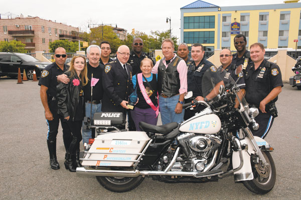 WORTHY CAUSE: Health warriors — including oncologist and ride organizer Dr. Patrick Borgen, center, and NYPD Transit Bureau Chief Joseph Fox, fourth from left in front — share the spotlight for helping to raise $4,000 for breast cancer research and treatment. Photo by Georgine Benvenuto